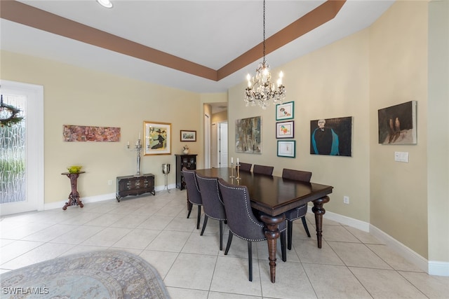 tiled dining room featuring a chandelier