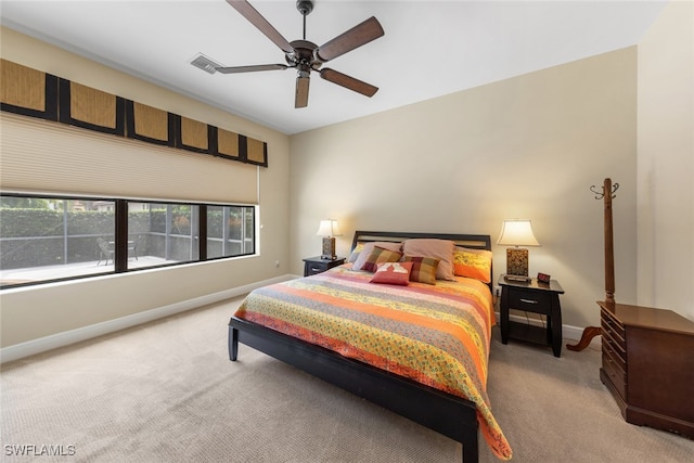 bedroom with carpet flooring, multiple windows, and ceiling fan