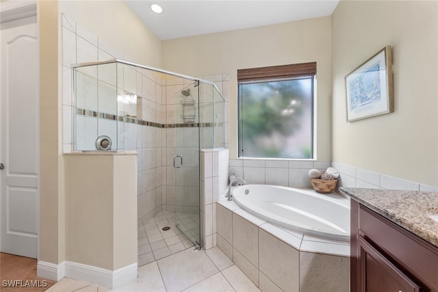 bathroom featuring vanity, separate shower and tub, and tile patterned floors