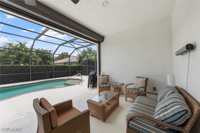 view of pool with glass enclosure and a patio