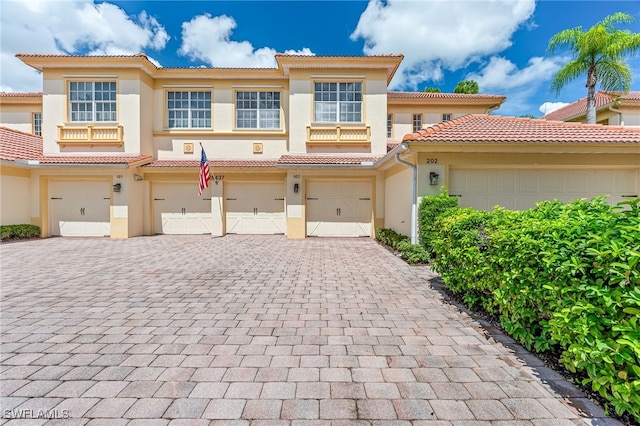 mediterranean / spanish house with a garage