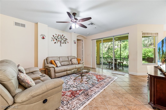 living room featuring ceiling fan and light tile patterned flooring