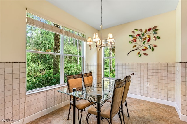 dining area with tile walls and plenty of natural light