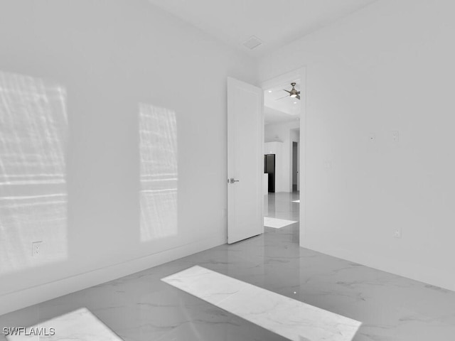 spare room with ceiling fan