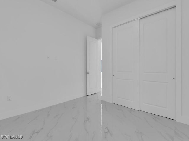 unfurnished bedroom with a closet