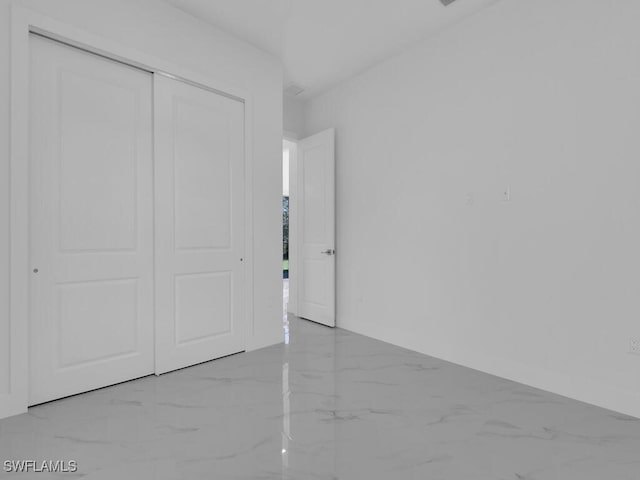unfurnished bedroom with a closet