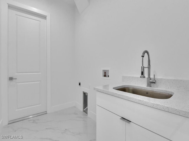 laundry room featuring electric dryer hookup, sink, cabinets, and washer hookup