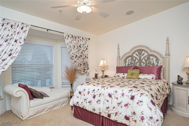 carpeted bedroom featuring vaulted ceiling and ceiling fan