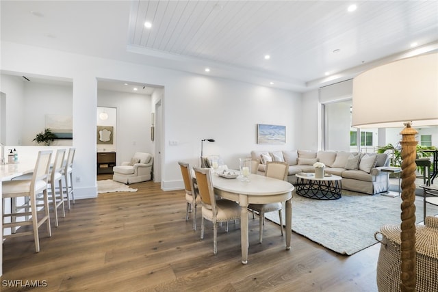 living room featuring hardwood / wood-style floors and wooden ceiling