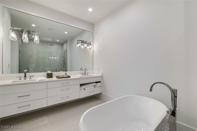 bathroom featuring separate shower and tub, tile patterned floors, and vanity