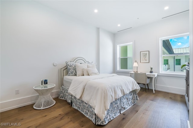 bedroom featuring recessed lighting, baseboards, and hardwood / wood-style floors