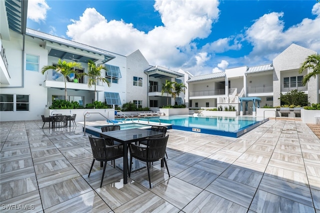 pool with a patio area