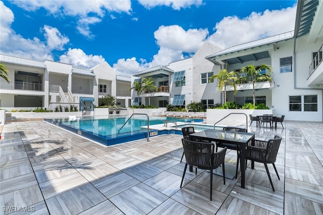 view of swimming pool with a patio