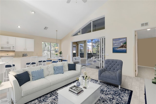 living room featuring recessed lighting, baseboards, visible vents, and high vaulted ceiling