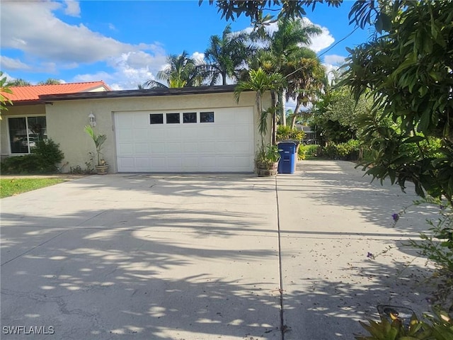 garage featuring driveway