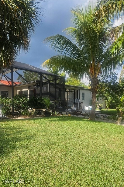 view of yard featuring a lanai