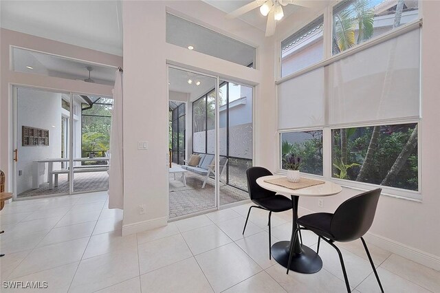 dining area with ceiling fan and light tile patterned floors