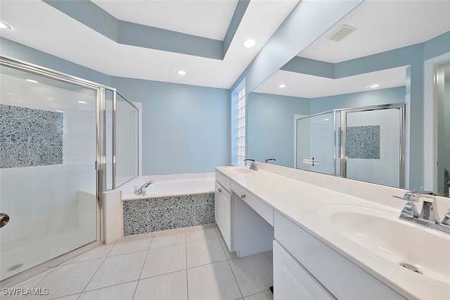 bathroom featuring vanity, plus walk in shower, and tile patterned flooring