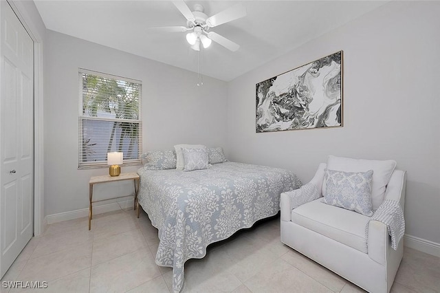 bedroom featuring ceiling fan, tile patterned floors, and baseboards