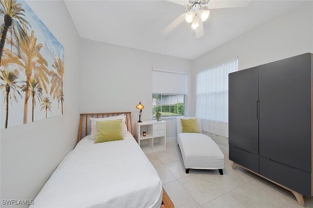 tiled bedroom with ceiling fan