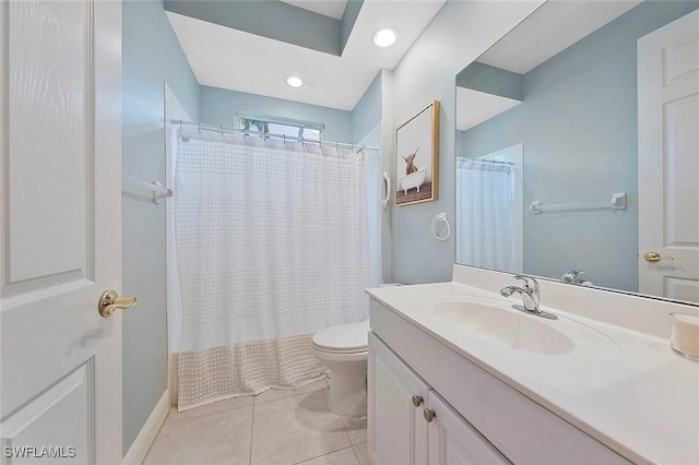 bathroom featuring tile patterned flooring, curtained shower, vanity, and toilet