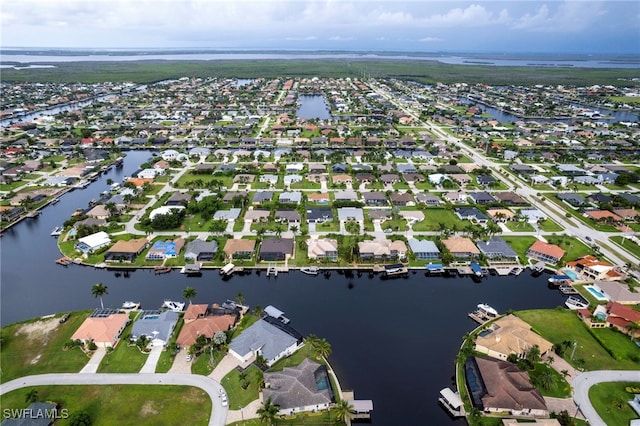 aerial view featuring a water view and a residential view