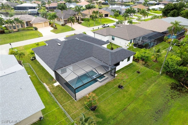 bird's eye view with a water view