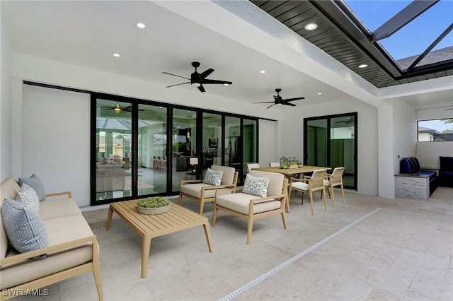 view of patio / terrace with ceiling fan and an outdoor living space