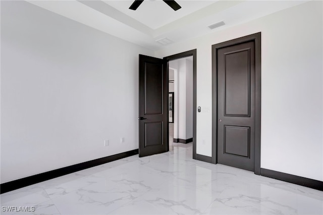 unfurnished room featuring marble finish floor, visible vents, ceiling fan, and baseboards