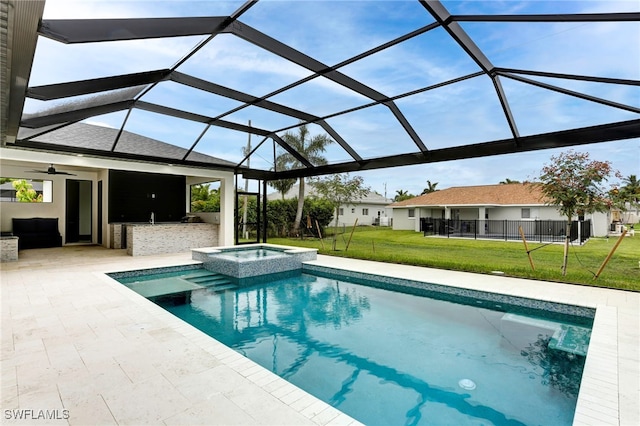 view of swimming pool with glass enclosure, a pool with connected hot tub, a patio area, and a lawn