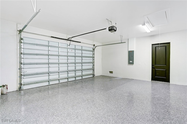 garage with electric panel and a garage door opener