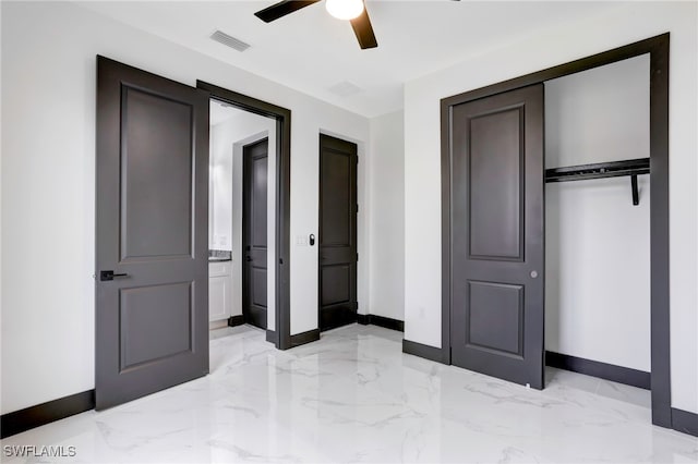 unfurnished bedroom with marble finish floor, baseboards, visible vents, and a closet