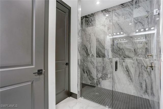 bathroom with marble finish floor and a marble finish shower