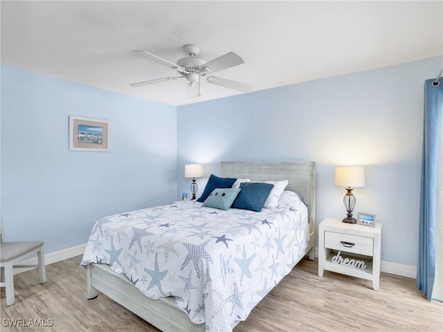 bedroom featuring light wood-type flooring and ceiling fan