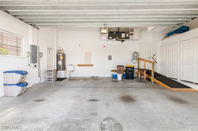 garage featuring electric water heater and electric panel