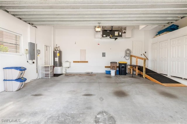 garage with electric panel, water heater, and a sink