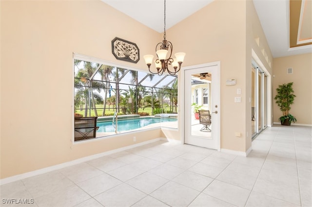 unfurnished dining area with an inviting chandelier and tile patterned flooring