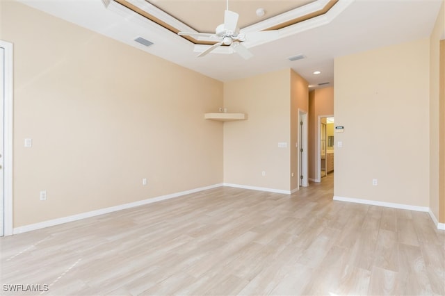 empty room with light hardwood / wood-style floors and ceiling fan