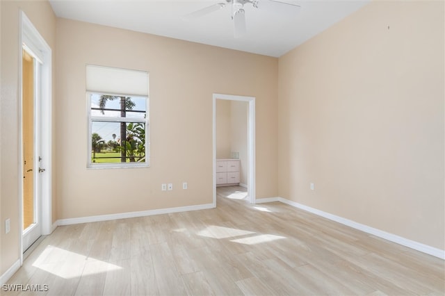 spare room with light hardwood / wood-style floors and ceiling fan