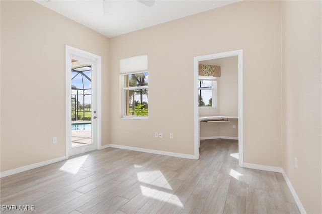 spare room featuring light hardwood / wood-style flooring