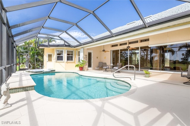 view of swimming pool featuring ceiling fan, a patio area, and a lanai