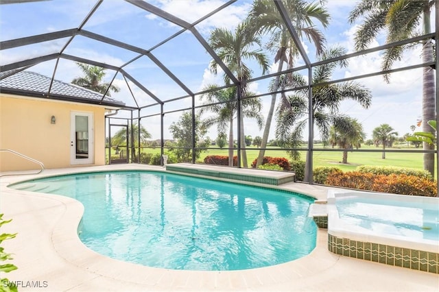 view of swimming pool with a patio, glass enclosure, and a pool with connected hot tub