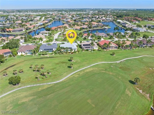 aerial view with a water view, a residential view, and golf course view