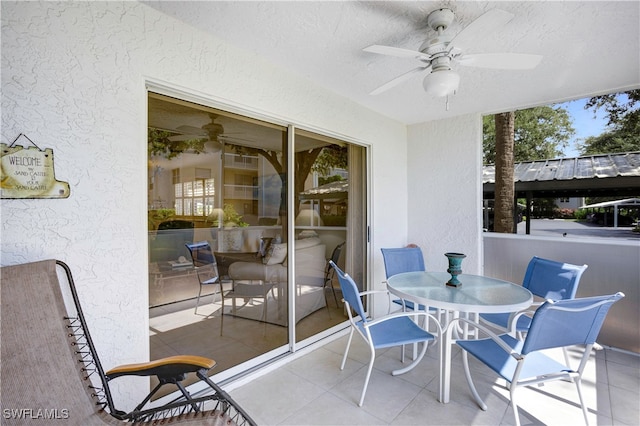 sunroom / solarium featuring a wealth of natural light and ceiling fan