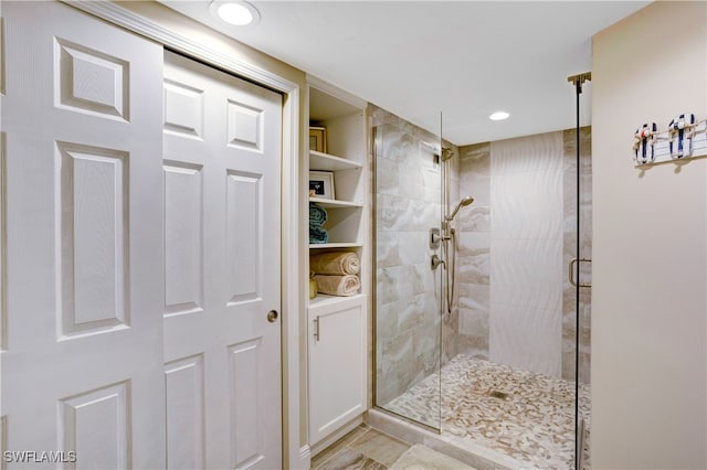 bathroom with a shower with shower door