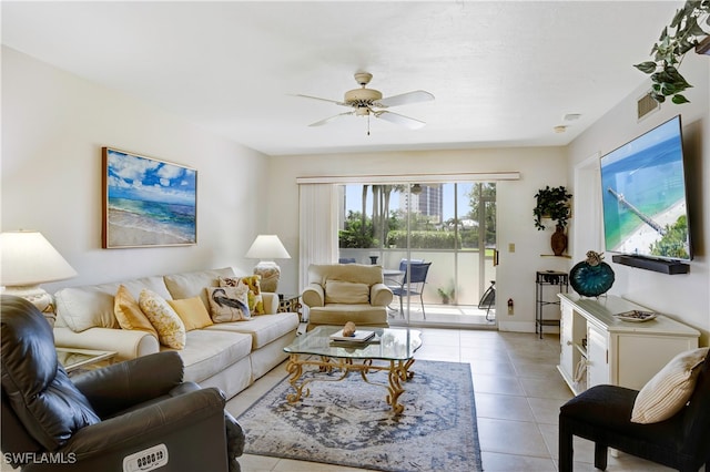 tiled living room with ceiling fan