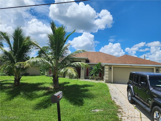 view of front facade with a front lawn and a garage