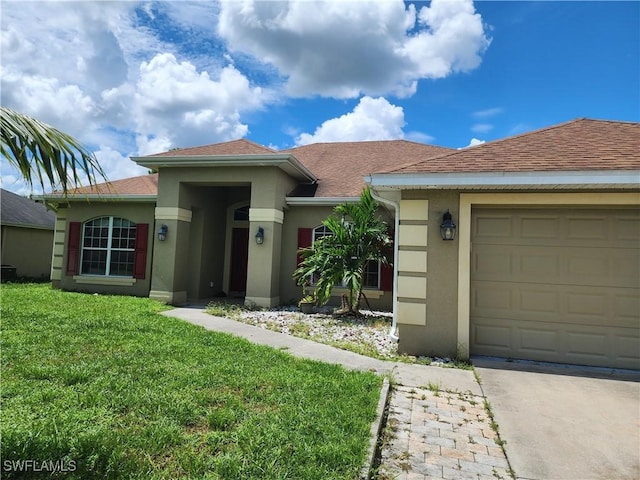 915 Alvin Ave, Lehigh Acres, FL 33971 - view of front facade featuring a front yard, an attached garage, a shingled roof, stucco siding, and concrete driveway