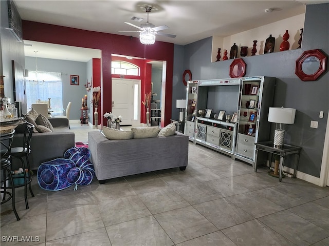 tiled living room with ceiling fan and a wealth of natural light