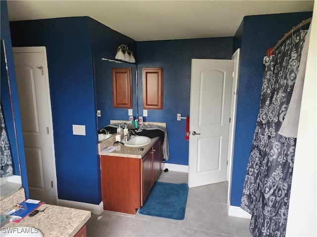 915 Alvin Ave, Lehigh Acres, FL 33971 - bathroom featuring tile patterned flooring, vanity, and baseboards